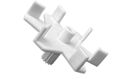 White plastic six-port T-valve rebuild gear kit component on a white background
