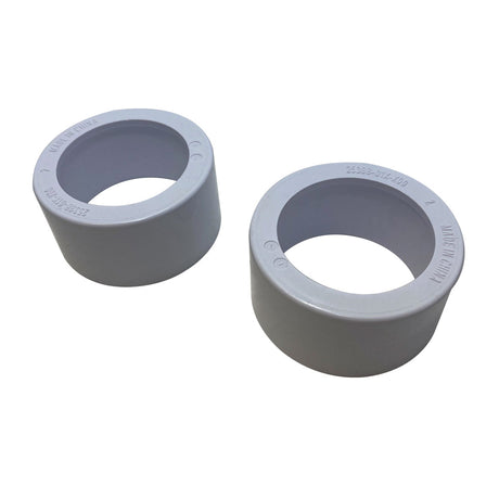 Two gray PVC pool defender spigot fittings with copper wire rings