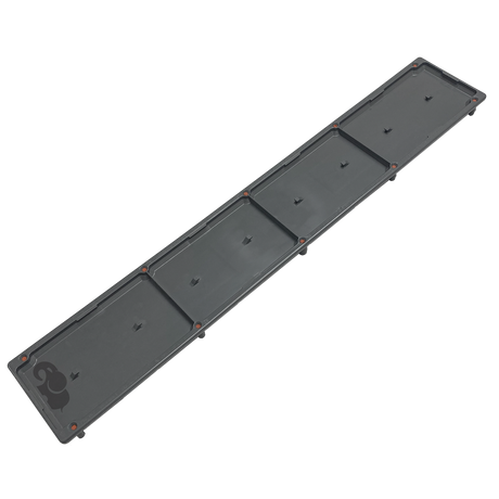 Dark gray single pebble top channel drain cover with rectangular segmented panels and orange corner markers