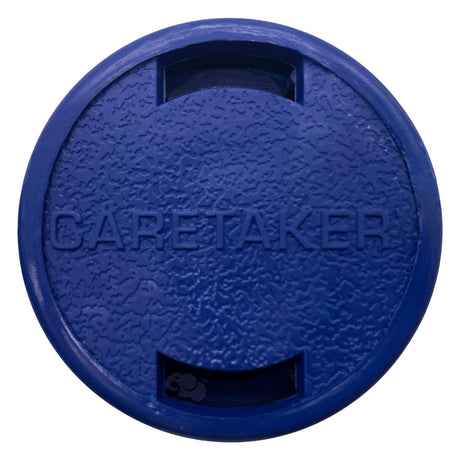 Dark blue Caretaker 99 Bayonet in-floor pool cleaning head with textured round cover and two rectangular openings