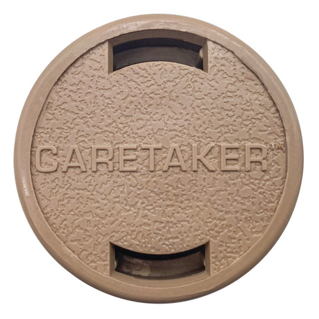 Tan Caretaker 99 bayonet in-floor pool cleaning head with textured round cover and two slot openings