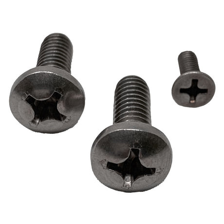 Three black Phillips-head screws on a white background