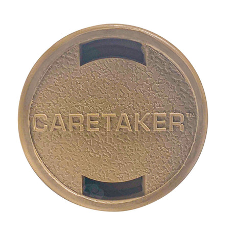 Tan Caretaker 99 high flow cleaning head with round textured face and centered Caretaker logo