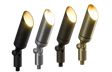 Four Pal Up/Garden path lights in black, silver, dark bronze, and brass finishes, each with a warm white glow.