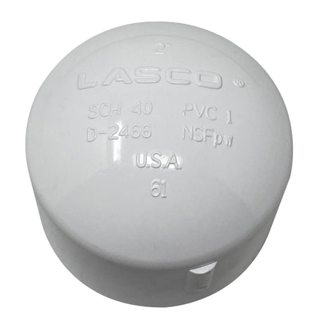 White Lasco PVC 2-inch pipe cap with embossed markings and side tab