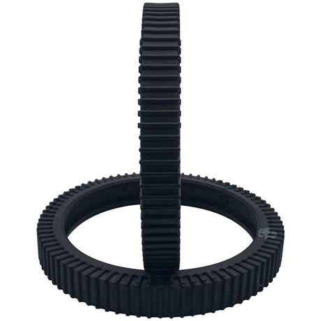 Two solid black ribbed tires, one standing upright and one lying flat