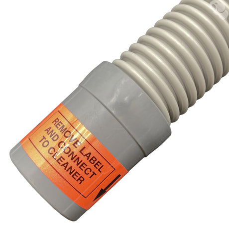 Gray pool cleaner hose connector with orange remove label