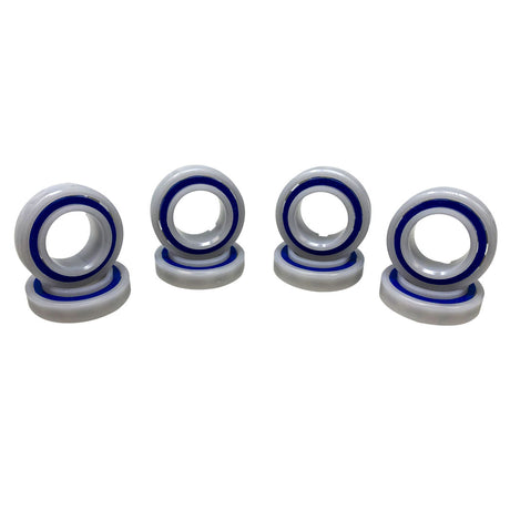 Four Polaris Quattro factory tune-up bearings with blue seals on a white background