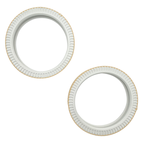 Two white round pool tile tread tape pieces with ridged edges and square center openings