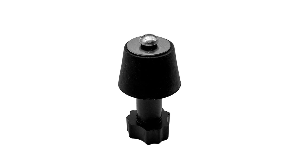 A small black plastic cap or knob with a hexagonal base and a small clear dome on top, isolated on a white background.
