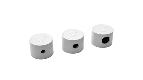 Three white PV3 pop-up head nozzle caps on a white background