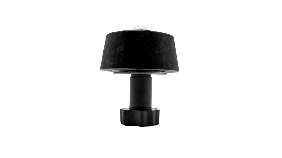 A black table lamp with a tapered drum shade, cylindrical stem, and hexagonal base, shown against a plain white background.