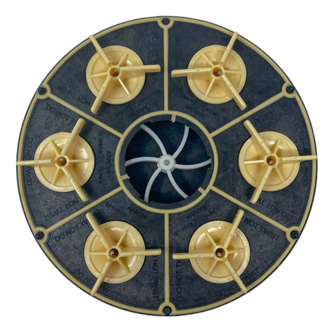 Top view of black Paramount 4-port 2-inch water valve lid with beige fittings and center opening