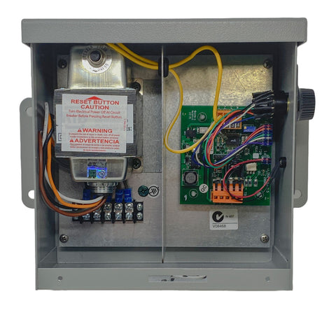 Open electrical control box with circuit board, wiring, and reset button for the UltraFlex2 cleaning system